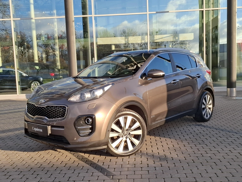 Автомобиль Kia Sportage IV поколение 2.0 AT 4WD (150 л.с.) Premium Коричневый 2017 с пробегом 137 047 км