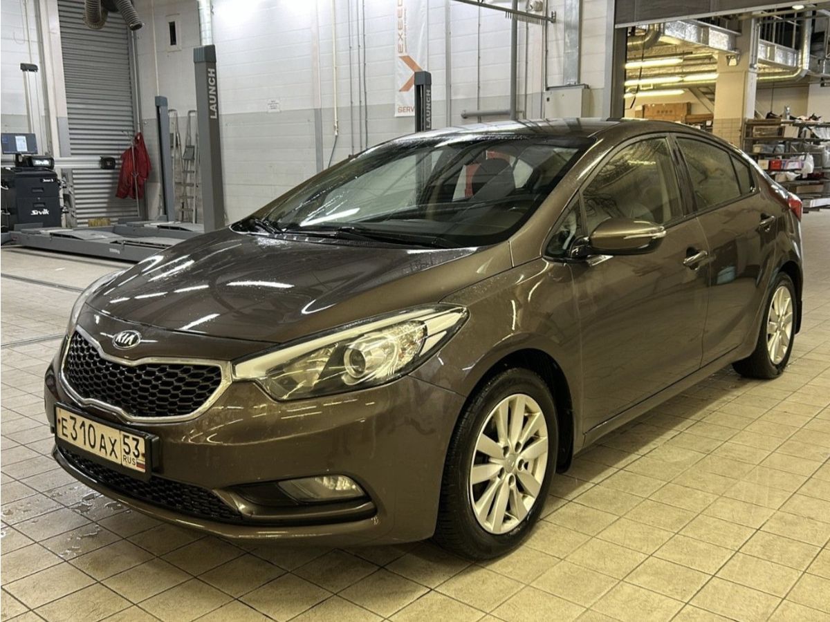 Kia Cerato III поколение 1.6 AT (130 л.с.) Prestige Бежевый 2013 с пробегом 173 300 км