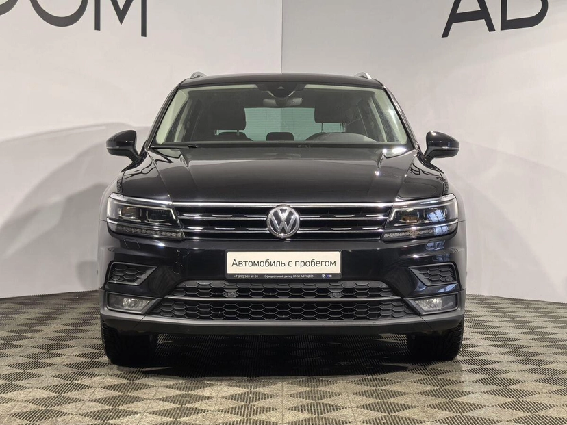 Автомобиль Volkswagen Tiguan II поколение 1.4 AMT 4WD (150 л.с.) Highline Чёрный 2020 с пробегом 104 565 км