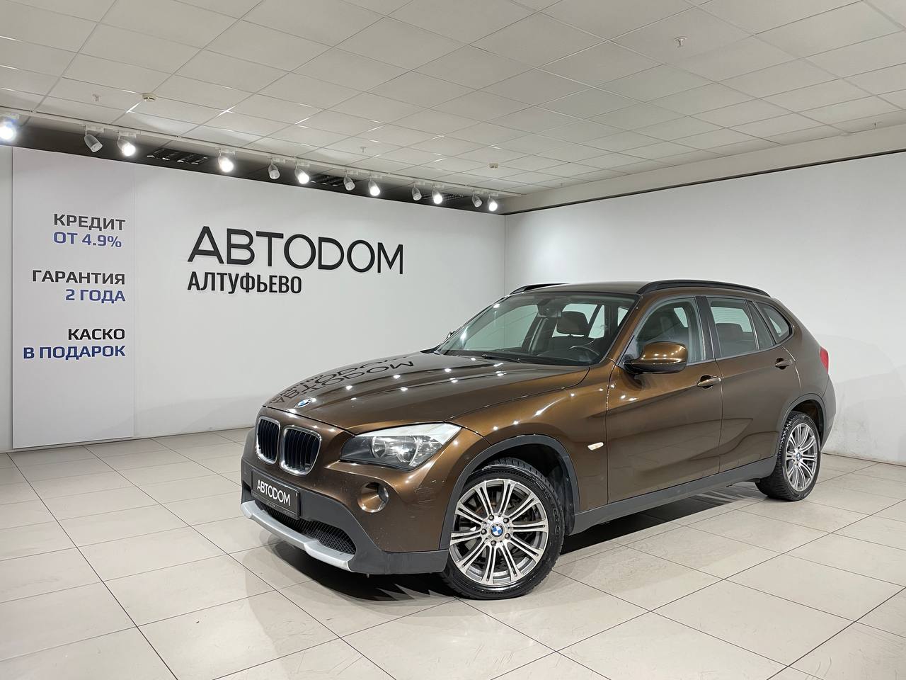 Автомобиль BMW X1 I поколение (E84) 2.0 AT (150 л.с.) Base Коричневый 2012 с пробегом 223 920 км