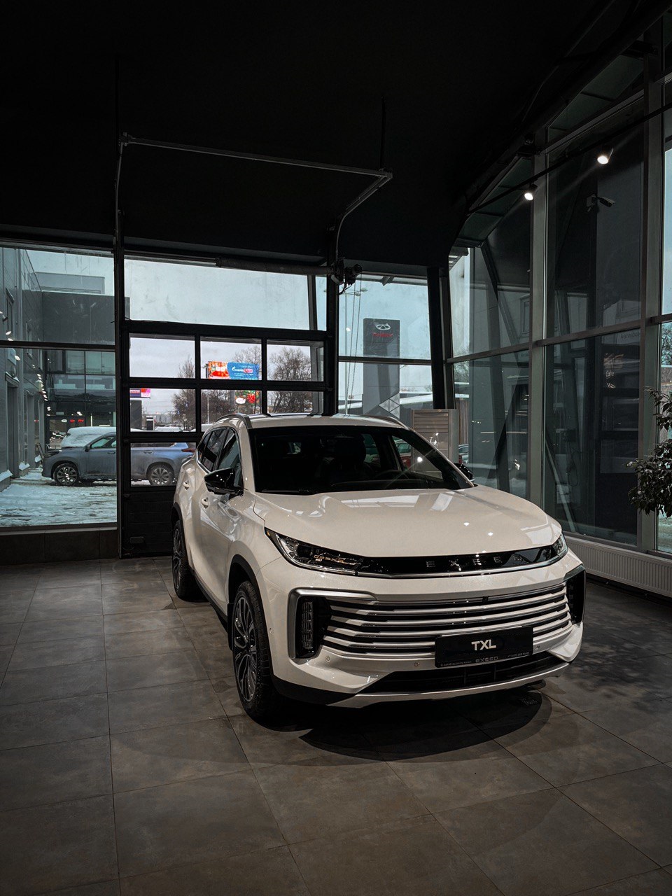 Автомобиль EXEED TXL I [2-й рестайлинг] 1.6 AMT 4WD (194 л.с.) Престиж Белый 2025 