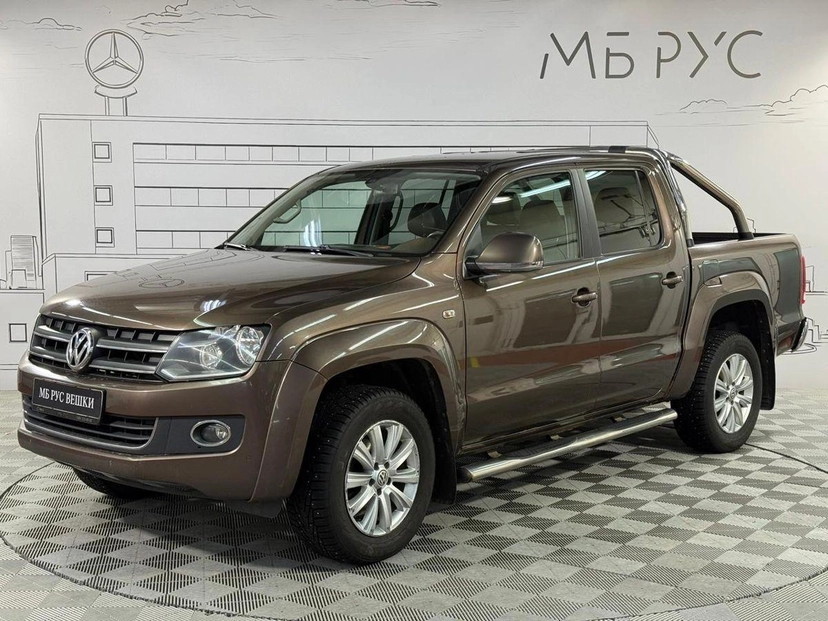 Автомобиль Volkswagen Amarok I поколение 2.0d AT 4WD (180 л.с.) Highline Коричневый 2013 с пробегом 129 000 км