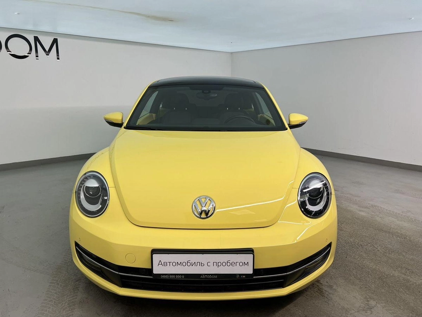 Автомобиль Volkswagen Beetle II поколение (A5) 1.2 AMT (105 л.с.) Beetle Жёлтый 2014 с пробегом 54 224 км