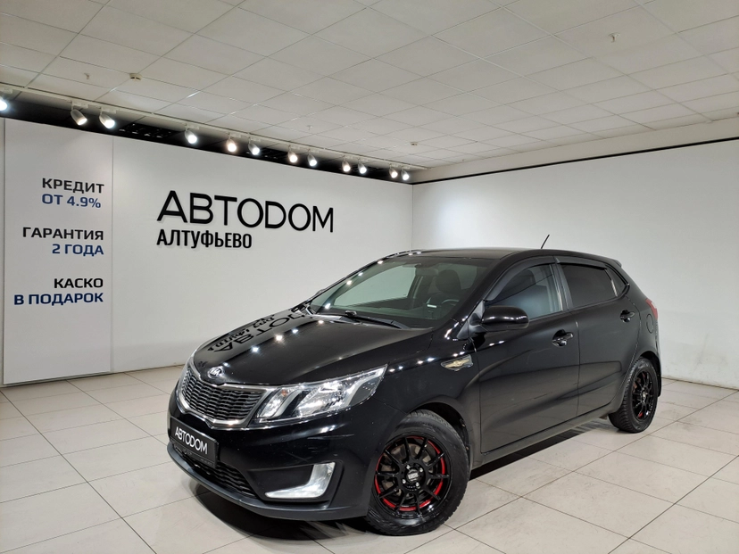 Автомобиль Kia Rio III поколение 1.6 6AT (123 л.с.) Luxe Чёрный 2015 с пробегом 158 892 км