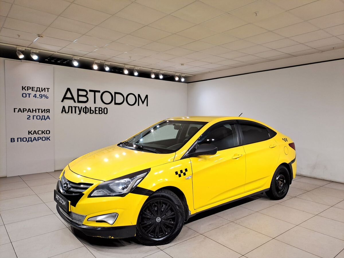 Автомобиль Hyundai Solaris I [рестайлинг] 1.6 AT (123 л.с.) Active Жёлтый 2015 с пробегом 210 000 км