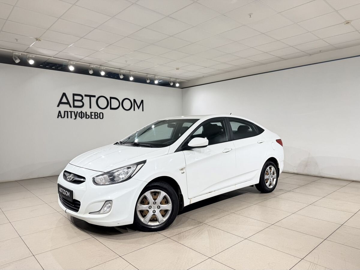 Hyundai Solaris I поколение 1.6 AT (123 л.с.) Optima Белый 2013 с пробегом 250 400 км