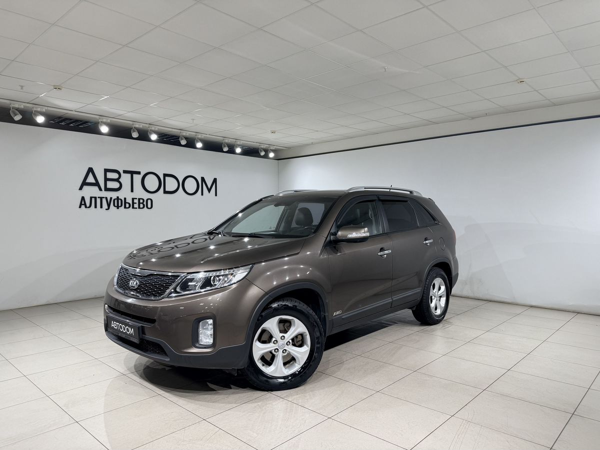 Kia Sorento II [рестайлинг] 2.4 AT 4WD (175 л.с.) New Luxe (2015) Коричневый 2013 с пробегом 65 909 км