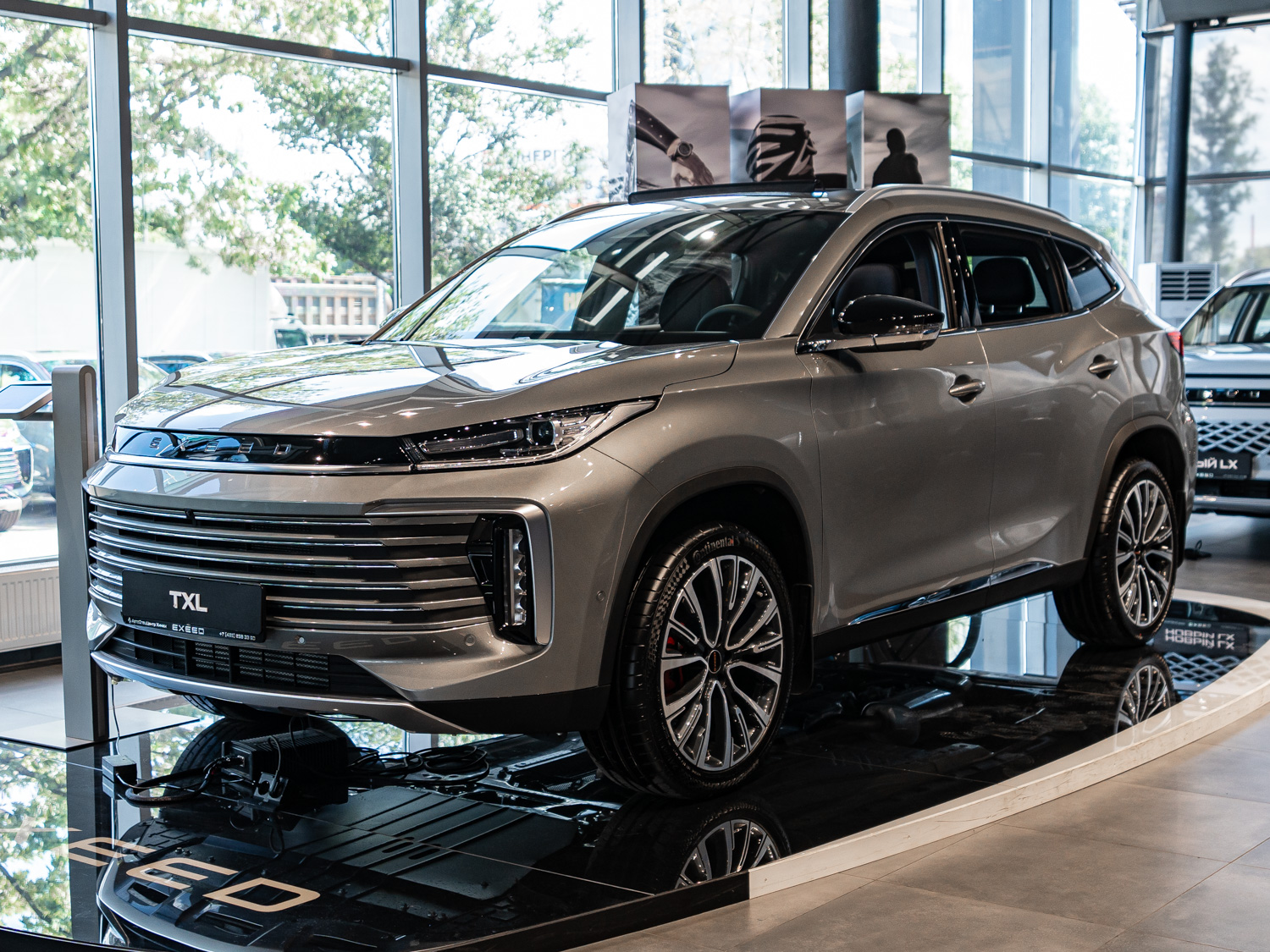 Автомобиль EXEED TXL I [2-й рестайлинг] 1.6 AMT 4WD (194 л.с.) Prestige Серый 2025 