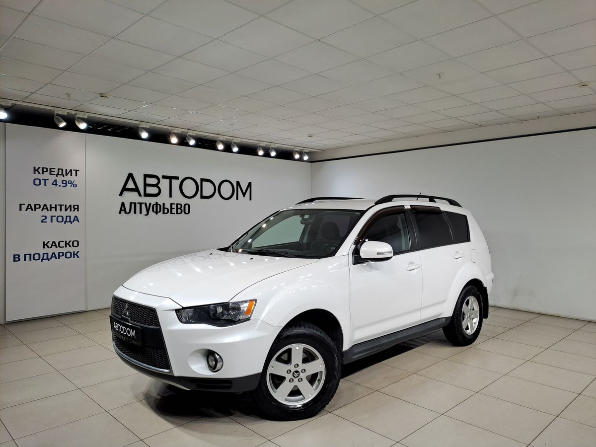 Автомобиль Mitsubishi Outlander II [рестайлинг] 2.0 CVT (147 л.с.) Intense Белый 2010 с пробегом 155 987 км